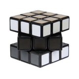 Колекционерски куб на Рубик Zynora Rubik’s Wednesday Кубче 3x3 – Логически пъзел в нюанси на сивото с декоративна стойка Ръката „Thing“ (8 години +)